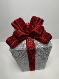 Silver Holiday Gift Box with Red Glitter Bow and Bell